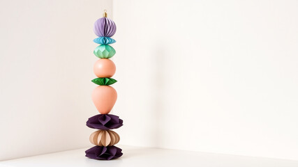 Colorful paper ornaments stacked modern decor