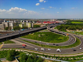Various residential buildings and a transport interchange on the outskirts of the city. The view from the drone.