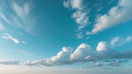 Vivid blue sky featuring layered cumulus and cirrocumulus clouds in a natural landscape.