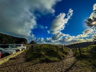 Beautiful lagoon and ocean beach in Piha, Auckland, New Zealand, before sunset.