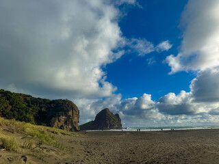 Beautiful lagoon and ocean beach in Piha, Auckland, New Zealand, before sunset.