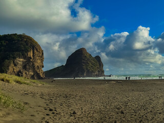 Beautiful lagoon and ocean beach in Piha, Auckland, New Zealand, before sunset.