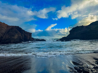Beautiful lagoon and ocean beach in Piha, Auckland, New Zealand, before sunset.