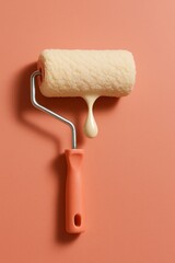 Obraz premium Paint roller with dripping white paint against a soft pink wall