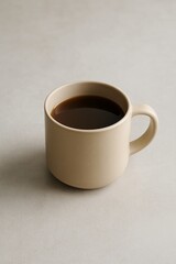A single mug filled with rich, dark coffee, ready to be enjoyed