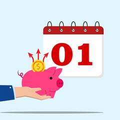 Financial calendar, financial planning, monthly budget planning concept. Hand holding a piggy bank which coin are taken out with the first date of the month on the calendar. 