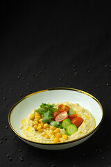 Hummus with chickpeas and vegetables.