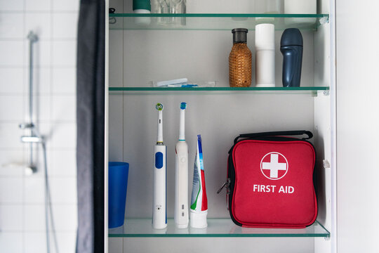 First aid kit with bathroom supplies kept in shelf