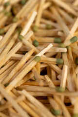 matches scattered in a large pile, closeup, a large number of thin wooden matches with a head