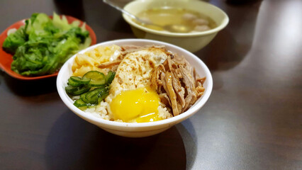 Delicious Hsinchu City cuisine — smoked duck meat on rice, fried egg, pickled cucumbers, blanched vegetables, duck meatball soup,a  temple-front eatery restaurant