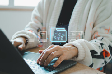 Internet education concept, e-learning resources, e-library, e-book, distant online courses. Businesswoman using laptop e-book icons on virtual screen.