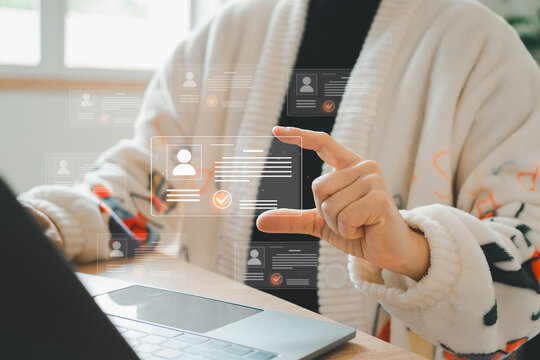 Digital identification or digital ID concept. Businesswoman use laptop and hand touch virtual screen of digital identification card to accessing databases by digital identity for cyber security.