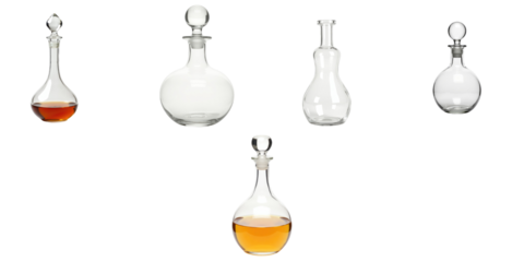Set of crystal glass liquor decanters with various shapes and sizes containing amber liquid isolated on transparent background for elegant display or product design