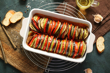 Baking dish of tasty Ratatouille on black background