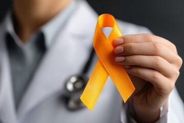 Female doctor holding orange awareness ribbon for leukemia support