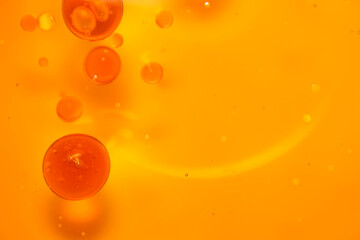 Orange Background with Floating Bubbles and Abstract Features