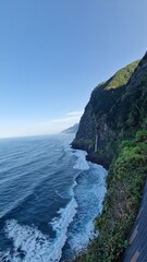 The Véu da Noiva viewpoint allows you to admire this abundant waterfall that erupts from the vegetation-covered slope, falling towards the sea.