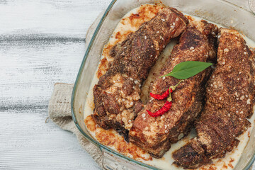 Baked pork ribs with spices, cold fat. Traditional ingredient for BBQ, picnic concept