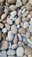 Madeira’s beaches are often covered in smooth pebbles made from igneous rocks like basalt and trachyte, shaped by erosion and wave action. These volcanic stones vary in color and texture, reflecting t