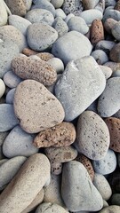 Madeira’s beaches are often covered in smooth pebbles made from igneous rocks like basalt and trachyte, shaped by erosion and wave action. These volcanic stones vary in color and texture, reflecting t