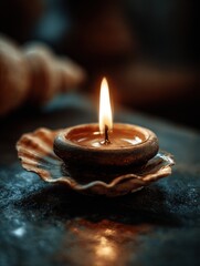 Burning Candle in Seashell Holder Casting Warm Light, Symbolizing Hope and Remembrance During Times of Reflection and Spiritual Growth : Generative AI