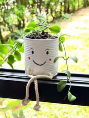 decorated outdoor gardening with recycled can