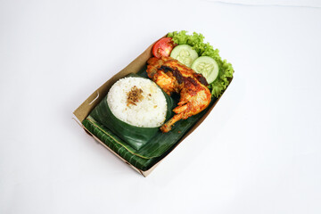 Ayam bakar, Indonesian roasted chicken served with rice and vegetables lalapan isolated white background