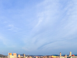 blue sky over town looking from top of a tall building