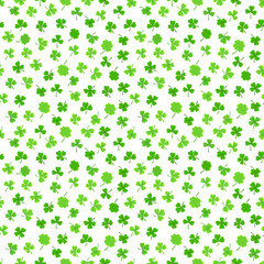 Shamrock or clover leaf flat design green seamless pattern falling leaves on white background vector illustration. Irish holiday celtic St Patrick day motif seamless pattern with shamrock clover leaf.