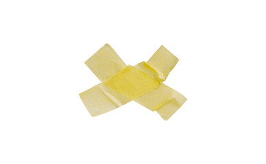 Yellow painter's tape isolated on white background, macro. Torn, crumpled, twisted strips of yellow painter's tape on white background, close-up.