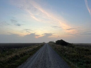 sunrise over the road a misty morning