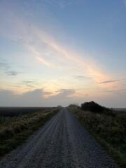 sunrise over the road a misty morning