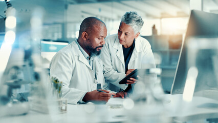 Analysis, scientists and team with tablet, lab or discussion for medical research for...