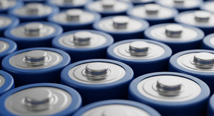 Close-up image of multiple blue cylindrical batteries arranged in rows, representing modern energy storage technology, power supply, and battery production for electronic and industrial applications.