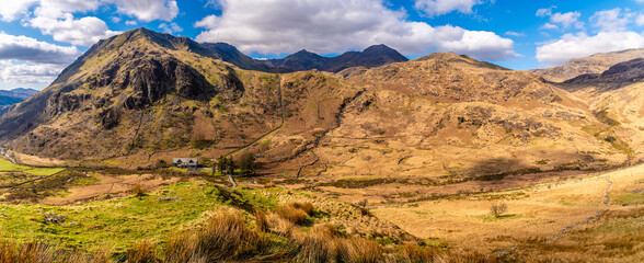 A panorama view down the rugged valley north of lake Gwynant in Snowdonia, Wales in springtime