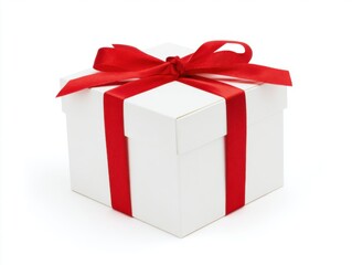 White gift box tied with red ribbon bow on white background
