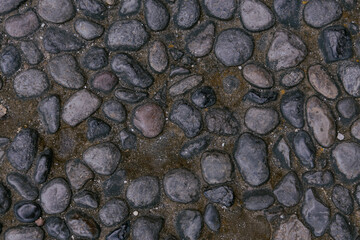 Gravel texture or gravel background for design. Real grunge texture background and small stone. Top view of ground gravel road.