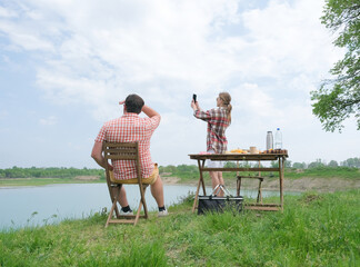 Family on picnic near the lake