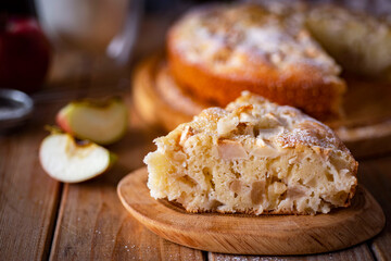 Dessert for breakfast: a slice of apple pie on a wooden table. Apple pie for breakfast. Close-up