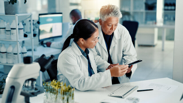 Science, team and discussion on tablet in lab for medical research, vaccine report and experiment. Scientist, people and digital app for pharmaceutical development, biotechnology study and innovation