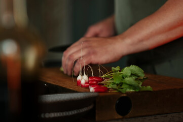Male chef preparing salad in restaurant kitchen
