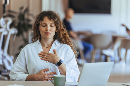 Calm Woman Practicing Mindful Breathing at Workplace for Stress Relief