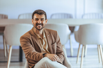 Professional Man Smiling in a Modern Office Environment