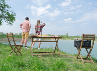 Family on picnic near the lake
