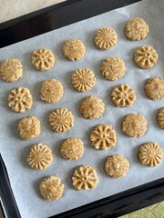 oatmeal cookie dough on parchment paper on a baking sheet