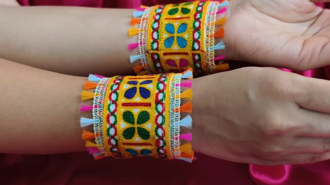 Colorful fabric cuffs - Kada with traditional embroidery and tassels, perfect for Navratri or folk dance celebrations, showcasing vibrant Indian festive fashion.