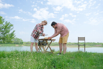 Family on picnic near the lake