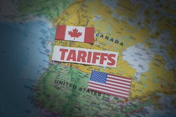 Canada and United States Tariff war concept background with flag and map along typography. Trade, usa, canada, business, tax, import © visuals6x