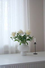 Beautiful and Elegant White Flowers Arranged Tastefully in a Modern Vase on a Minimalist Table