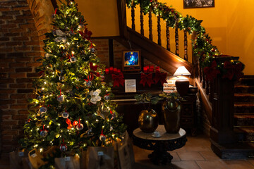 Christmas tree illuminating cozy home interior in asturias, spain